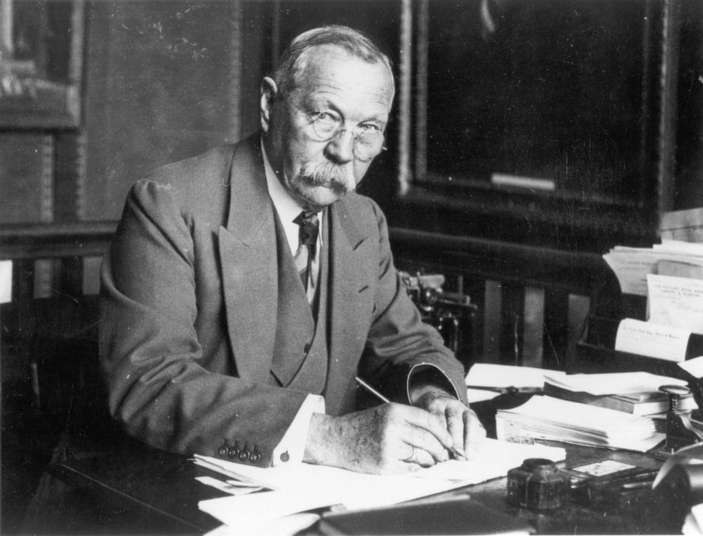 Photo of Arthur Conan Doyle writing from the Portsmith Library's Doyle collection.